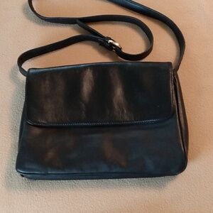 Black purse with several compartments and coin purse
